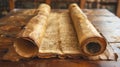 Ancient manuscript scroll on wooden table with historical texts. Royalty Free Stock Photo