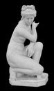Ancient marble statue of a nude woman. Antique naked female sculpture. Sculpture isolated on black background Royalty Free Stock Photo