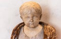 Marble statue representing a young roman boy Royalty Free Stock Photo