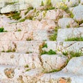 ancient marble steps with grass breaking through the stones, background Royalty Free Stock Photo