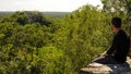 Ancient Maya ruins of Calakmul in the thick jungle and tree landscapes on a sunny day in the YucatÃÂ¡n Peninsula of Mexico.