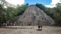 ancient Mayan temple of coba with tourists Royalty Free Stock Photo