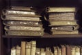 Ancient medieval books on the shelf in the bookcase