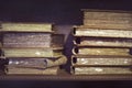 Ancient medieval books on the shelf in the bookcase