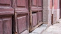 Ancient medieval doors. Entrance to the antic old house Royalty Free Stock Photo