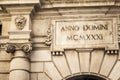 Ancient medieval latin anno domini, 1931, detail facade in buil Royalty Free Stock Photo