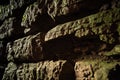 Medieval limestone dark wall with moss