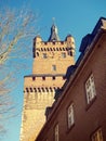 Ancient medieval town castle stone tower with clock vertical vie Royalty Free Stock Photo