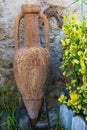 Ancient Mediterranean amphora in a garden. Spain Royalty Free Stock Photo
