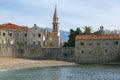 Ancient Mediterranean architecture. View of the Old Town of Budva. Bell tower of Church of St. John. Montenegro Royalty Free Stock Photo