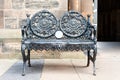 Ancient metal bench in old Glasgow University garden. UK, Scotland.