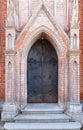 Ancient metal gates or door of old red brick church Royalty Free Stock Photo