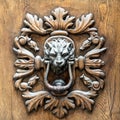 Ancient metal handle of a wooden door Royalty Free Stock Photo