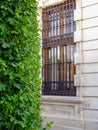 Ancient metal openwork wrought iron lattice on the window of an old building. Close-up Royalty Free Stock Photo