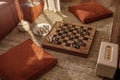 Ancient metal Roman Chess Set with silver and gold plated pieces on solid oak wood Board. Royalty Free Stock Photo