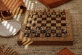 Ancient metal Roman Chess Set with silver and gold plated pieces on solid oak wood Board. Royalty Free Stock Photo