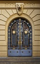 Ancient metallic door on yellow facade in Belo Horizonte