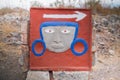 Ancient Mexican plaque with rocks and dry grass as background