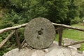 Ancient millstone for chestnut milling , Italy Royalty Free Stock Photo