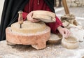 Ancient millstone that was turned by hand to produce flour. Royalty Free Stock Photo