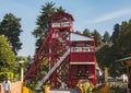 Ancient mining structure in the shape of a tower with its characteristic red color
