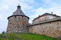 Ancient monastery tower and fragment of wall Royalty Free Stock Photo