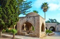 The ancient monastery yard with the beautiful fountain in garden, Ayia Napa, Cyprus. Royalty Free Stock Photo