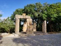 Ancient Monument in a garden with a blue sky in BacalhÃÂ´a Buddha Eden