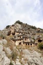 Ancient monumental lycian rock-cut tombs in archaeological site Myra near Demre, Turkey Royalty Free Stock Photo