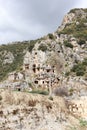 Ancient monumental lycian rock-cut tombs in archaeological site Myra near Demre, Turkey Royalty Free Stock Photo