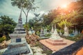 Ancient mystical thai cemetery near old temple. Thailand.