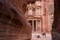 Ancient nabataean temple Al Khazneh Treasury located at Rose city - Petra, Jordan. Two camels infront of entrance. View from Siq Royalty Free Stock Photo