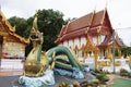 Ancient naga or antique naka statue of Wat Phra Kaew temple for thai people traveler travel visit and respect praying and blessing Royalty Free Stock Photo