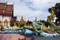 Ancient naga or antique naka statue of Wat Phra Kaew temple for thai people traveler travel visit and respect praying and blessing Royalty Free Stock Photo