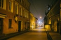 Ancient narrow night Vilnius street with old architecture