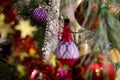 Ancient New Years decorations on a tree. Red and violett balls.