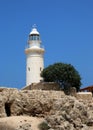 The ancient Odeon Amphitheatre with the lighthouse on the background. Paphos, Cyprus.