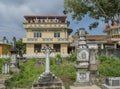 Ancient old cemetery near buddhist temple with gravestones and monuments in Weligama town Royalty Free Stock Photo