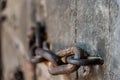 Ancient old chain with lock concept on old door, wallpaper, background Royalty Free Stock Photo