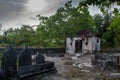 Ancient old creepy cemetery with crypt and graves at the tropical local island Fenfushi