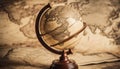 Ancient old globe on the vintage map background. Selective focus. Retro style. Science, education Royalty Free Stock Photo