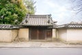 Ancient and old Japanese house gate in Nara, Japan under bright blue sky Royalty Free Stock Photo