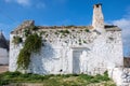 Ancient old white stone house in a countryside village in Puglia