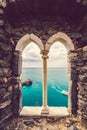 Ancient old window with sea view. Porto Venere, Italy