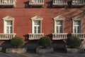 Ancient orange brick wall and interior vintage arch windows frame white white blank background in window display shop outside and