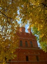 Ancient Orthodox Christian Church surrounded by orange birch leaves. Pushkin, suburb of Saint Petersburg, Russia. Beautiful Temple Royalty Free Stock Photo