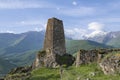 Ancient Ossetian defensive tower against the background of the Caucasian mountains Royalty Free Stock Photo