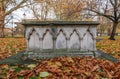 Ancient Overgrown Tombstones And Graves At Churchyard Garden On Autumn Morning