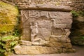 Ancient pagan cave temple with figures of tree, woman and deer carved in stone, symbols of life, maternity and clan, religion