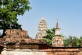 An ancient pagoda in an old temple and a very old brick wall in Ayutthaya, Thailand